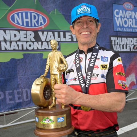 Johnson holding his NHRA Wally trophy from last year's Super Grip NHRA Thunder Valley Nationals victory.