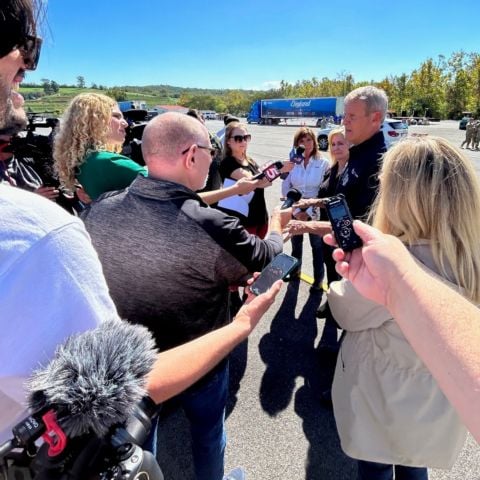 Tennessee Governor Bill Lee meets with media Monday at Bristol Motor Speedway following a tour of the Northeast Tennessee Disaster Relief Center.