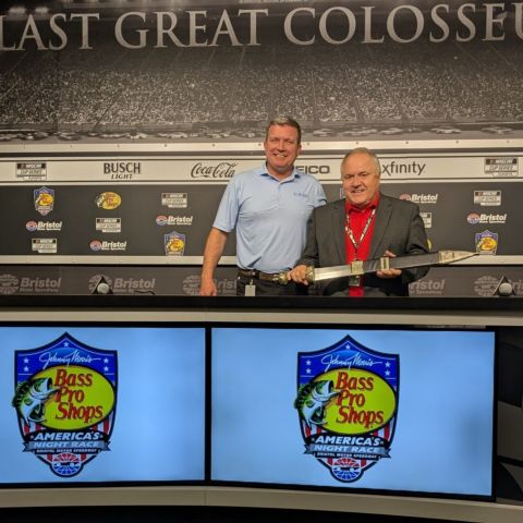 BMS President and General Manager Jerry Caldwell (left) presented Doug Rice with a BMS Gladiator Sword and announced the naming of the radio booth in the BMS race control tower the "Doug Rice Radio Broadcasting Booth at Bristol Motor Speedway" during a news conference on Friday.