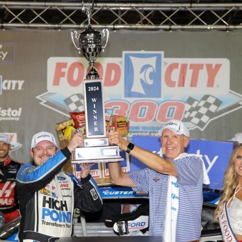 Cole Custer (left) and Food City CEO Steve Smith celebrate in Bristol Motor Speedway Victory Lane Friday after Custer raced to the victory in the Food City 300 and also earned the NASCAR Xfinity Series regular season title.