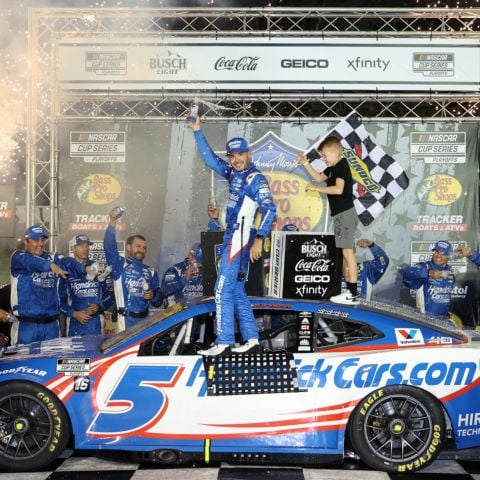 Kyle Larson and his son Owen celebrate on top of Larson's Chevy Camaro Saturday night in Bristol Motor Speedway Victory Lane after Larson won his second Bass Pro Shops Night Race title. With the victory Larson advanced to the NASCAR Playoffs Round of 12.