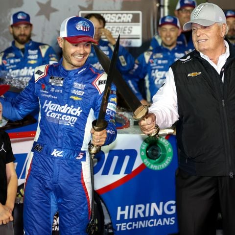 America's Night Race winner Kyle Larson (left) crosses BMS Gladiator Swords with his team owner Rick Hendrick in Victory Lane Saturday night at Bristol Motor Speedway.