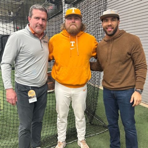 NASCAR Cup Series star Bubba Wallace (right) threw out the ceremonial first pitch at yesterday's Tennessee Vols game vs. Xavier University. Prior to the pitch Wallace warmed up in the indoor practice facility. Vols assistant coach Kirby Connell and Bristol Motor Speedway president and general manager Jerry Caldwell wished him good luck.