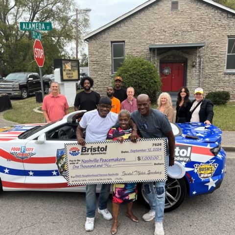 Clemmie Greenlee, named BMS Neighborhood Hero for the Nashville region, is surrounded by members of her Peacemakers organization during today's announcement.