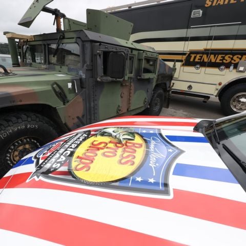 The BMS Pace Car sits beside a Tennessee National Guard Humvee and a Tennessee Highway Patrol bus during today's ceremony.