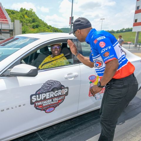 Antron Brown gives Chef T some pointers before her run.