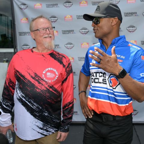Antron Brown shares a laugh with Super Grip CEO Scott Whitney prior to the NHRA Celebrity Drag Challenge race at Bristol Dragway.