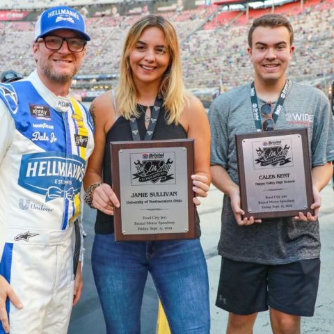 In 2023 the Dale Earnhardt Jr. Scholarship was presented to Jamie Sullivan (center) of UNOH and Kaleb Kent (right) of Happy Valley High School in Watagua, Tenn. They were able to get a quick photo with Earnhardt Jr. during driver intros at last year's Food City 300.