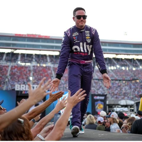 Bass Pro Shops Night Race pole winner Alex Bowman greets fans at Bristol Motor Speedway during driver introductions.